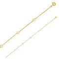 Pulsera de oro ancora con perlas enjauladas